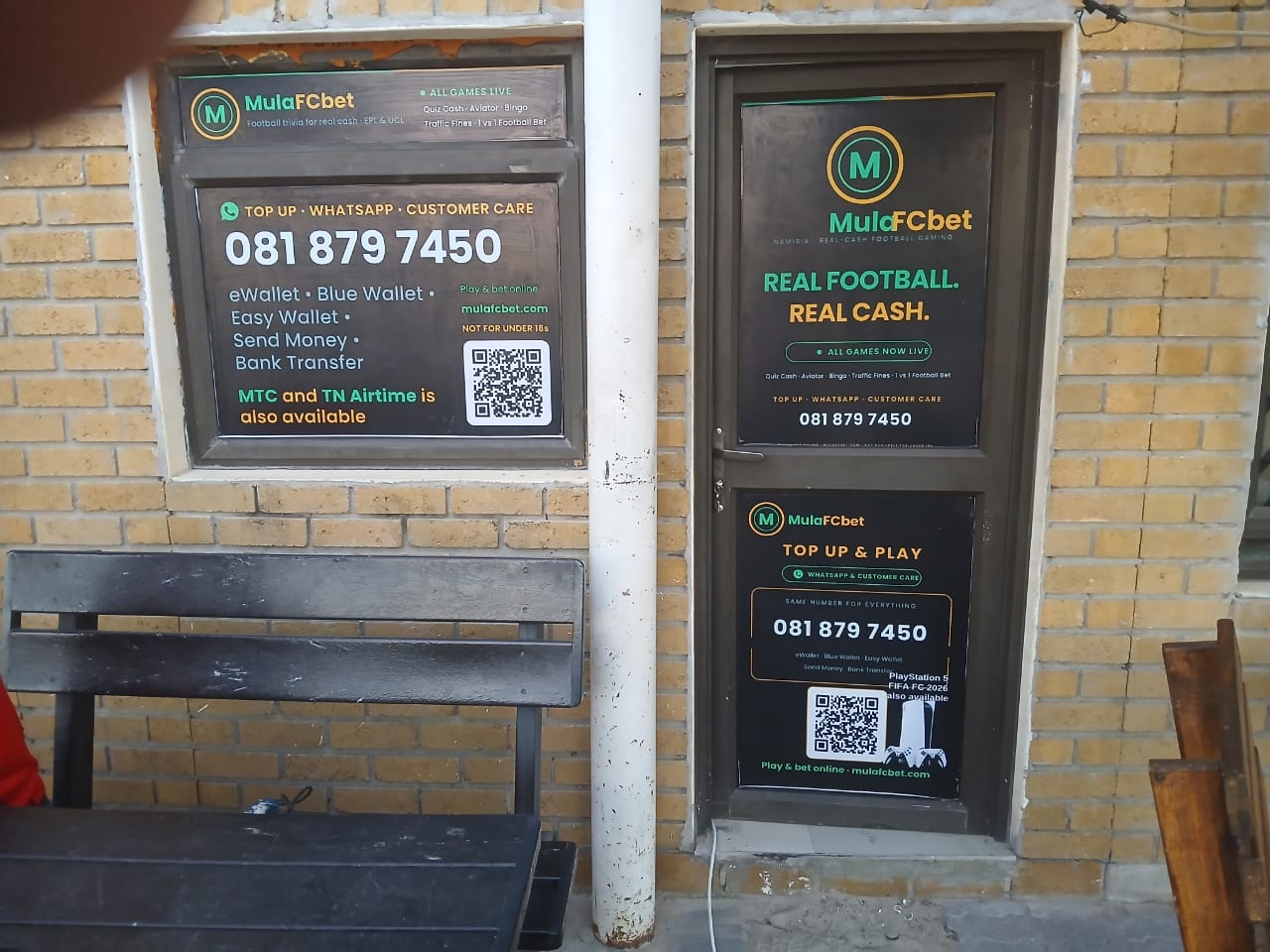 MulaFCbet branch storefront in Namibia showing signage, contact number, and QR codes